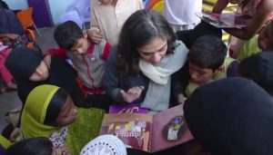 Tahera Hasan reads to children at Khel