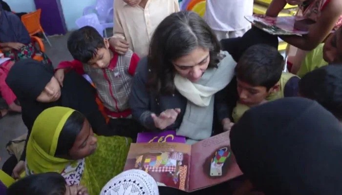Tahera Hasan reads to children at Khel
